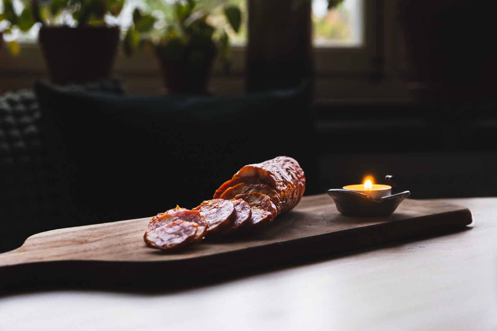 Charcuterie still life by candlelight